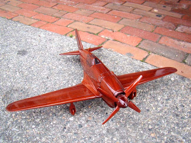 A beautiful carved mahogany depiction of a World War II fighter plane, possibly a Grumman Hellcat F6F — image 4